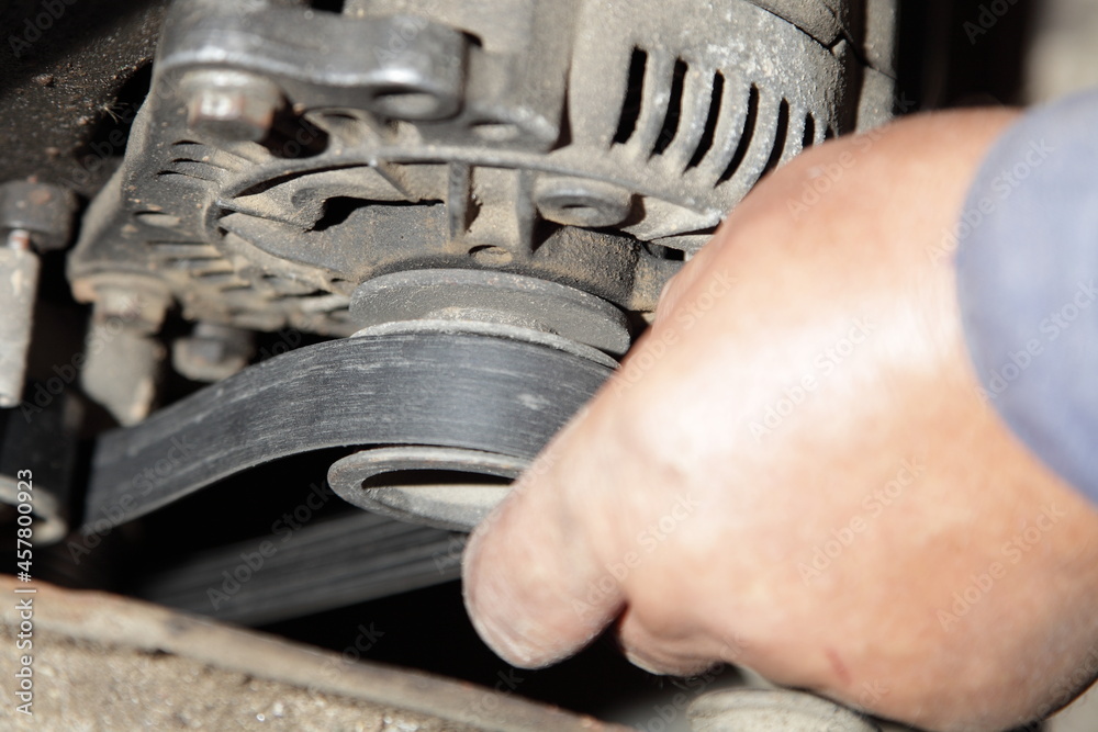 Car motor alternator belt tension checking service man hand checks