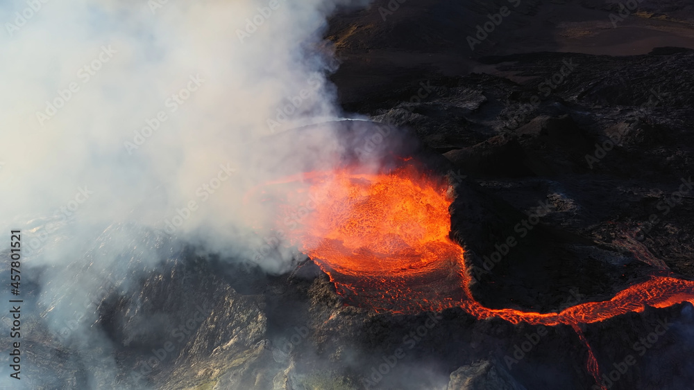 Obraz premium Lava flows from Mount Fagradalsfjall, aerial evening view, iceland lava spill out of the crater Mount Fagradalsfjall, September 2021, Iceland 