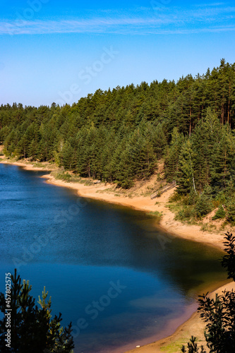 Quarry reservoir with forest on its shore