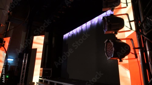 Backsatage atmosphere before the show. Stage is flooded light. Amazing abstractive loop on the big LED screen.