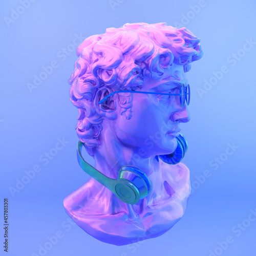 Gypsum statue of David's head. Creative. Plaster statue of David's head in blue sunglasses and crown. Minimal concept art.