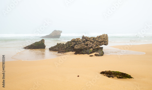 Foggy ocean coast Bordeira beach Algarve Portugal