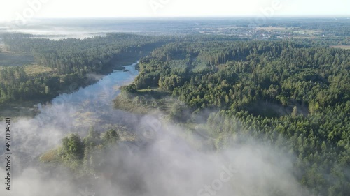 Morning fog over the forest and Lake Komosa photo