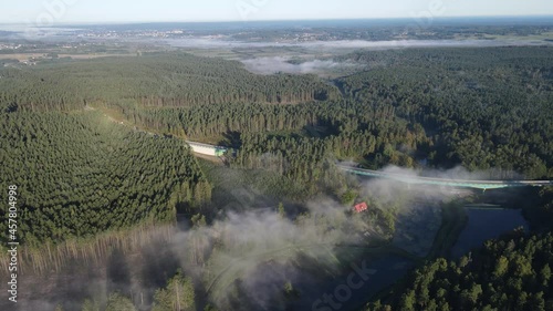 Morning fog over the forest and Lake Komosa photo