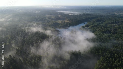 Morning fog over the forest and Lake Komosa photo