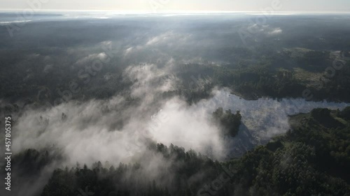 Morning fog over the forest and Lake Komosa photo