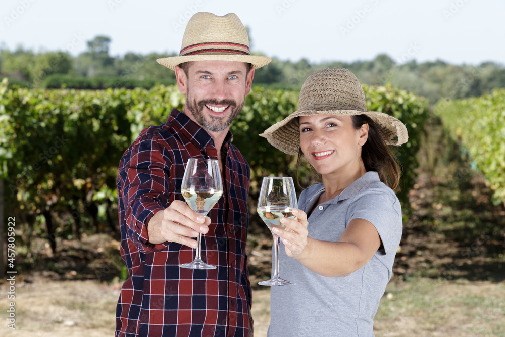 happy coupl drinking wine outdoors