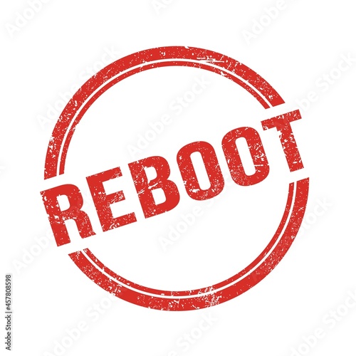 REBOOT text written on red grungy round stamp.