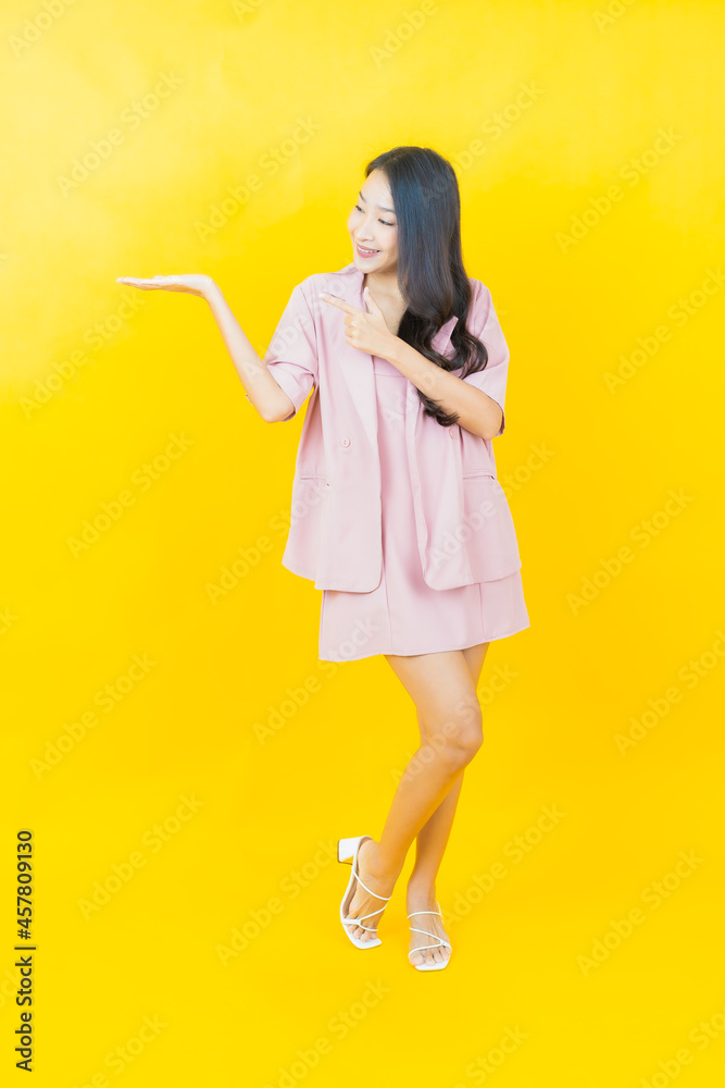 Portrait beautiful young asian woman smile with action Portrait beautiful young asian woman smile with action