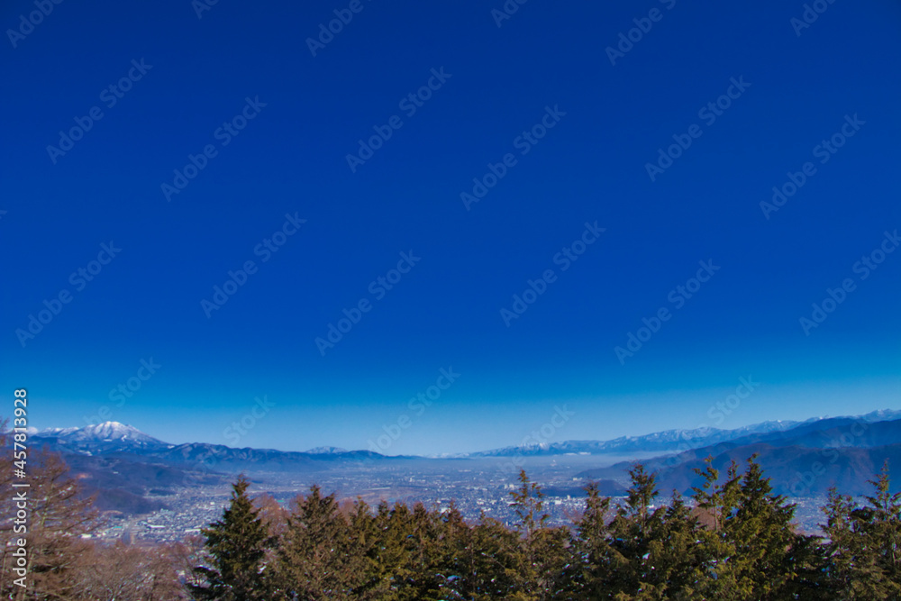 Nippon Shinshu Nagano Prefecture's 姨 and blue sky and snowfall