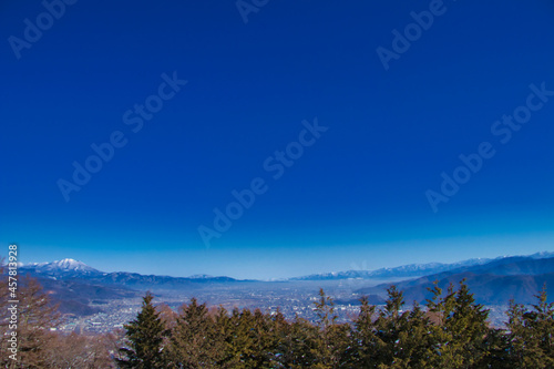 Nippon Shinshu Nagano Prefecture's 姨 and blue sky and snowfall