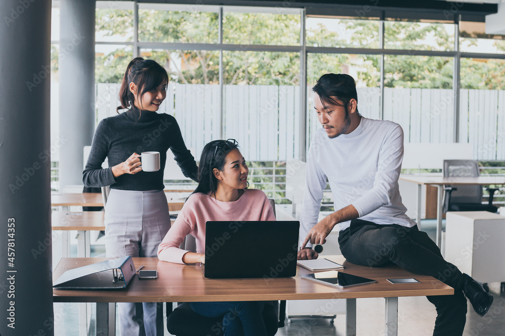 Asian business team who consulting at the office with daylight from window and blur garden background. Asian business team who consulting at the office with daylight from window and blur garden background.