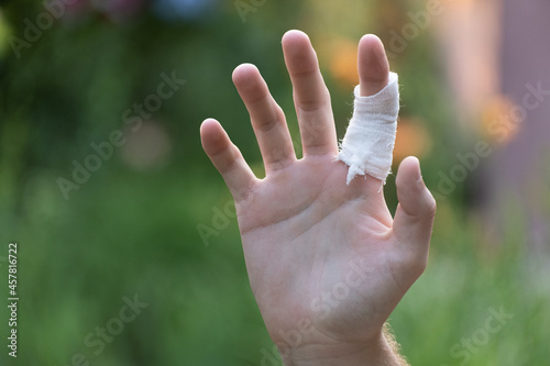 The teenager's bandaged finger after a cut