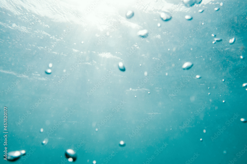 Underwater View of Bubbles In Deep Blue Ocean. Close Up Water. Background Underwater View of Bubbles In Deep Blue Ocean. Close Up Water. Background