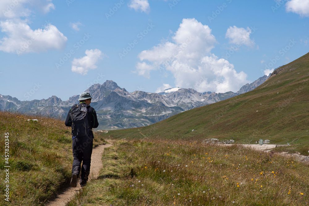 Mountain landscape in summer with a hiker