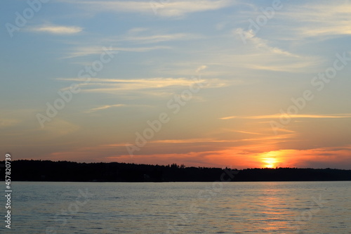 Beautiful sunset at a Scandinavian lake called Malaren or Mälaren. Outside in the evening. Concept of freedom and peace. Copy space for extra text. Stockholm, Sweden, Europe.
