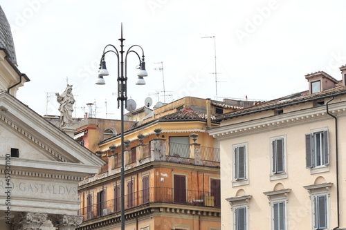 Via Margutta Buildings Close Up with Santa Maria dei Miracoli Church Detail with Statue in Rome, Italy photo