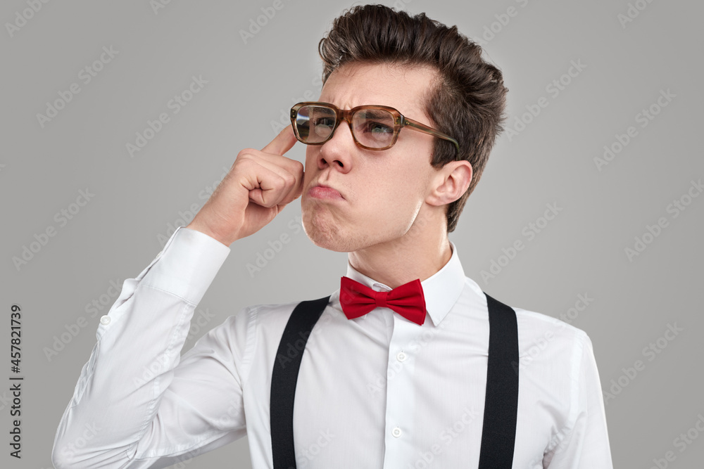 Smart thoughtful nerd guy in eyeglasses Smart thoughtful nerd guy in eyeglasses