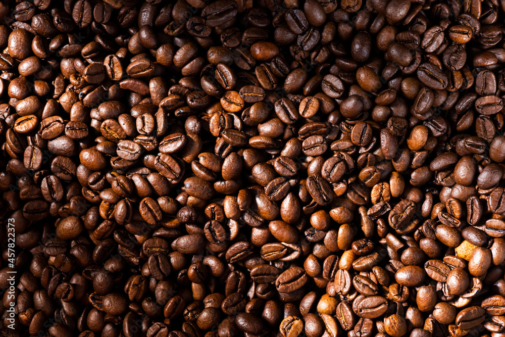 Roasted Coffee Beans Background Texture in Warm Light
