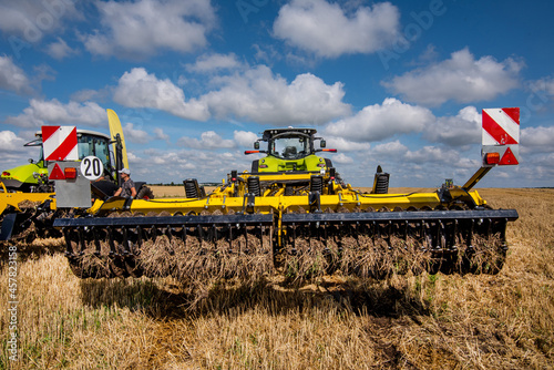 multi-disc cultivator, tillage system in operation with tractor in field