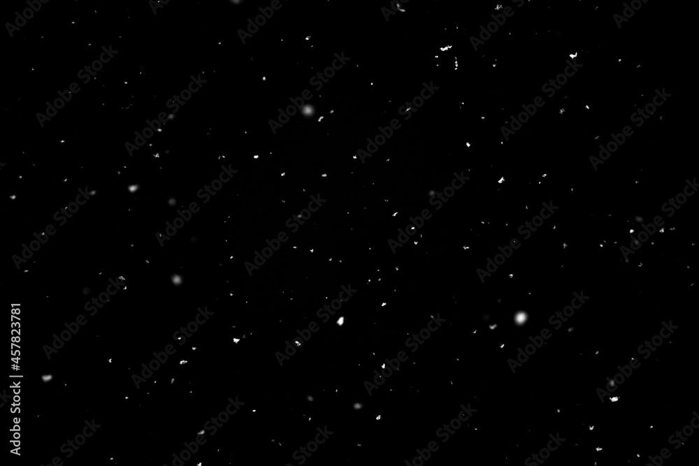Snow falling on black background Snow falling on black background