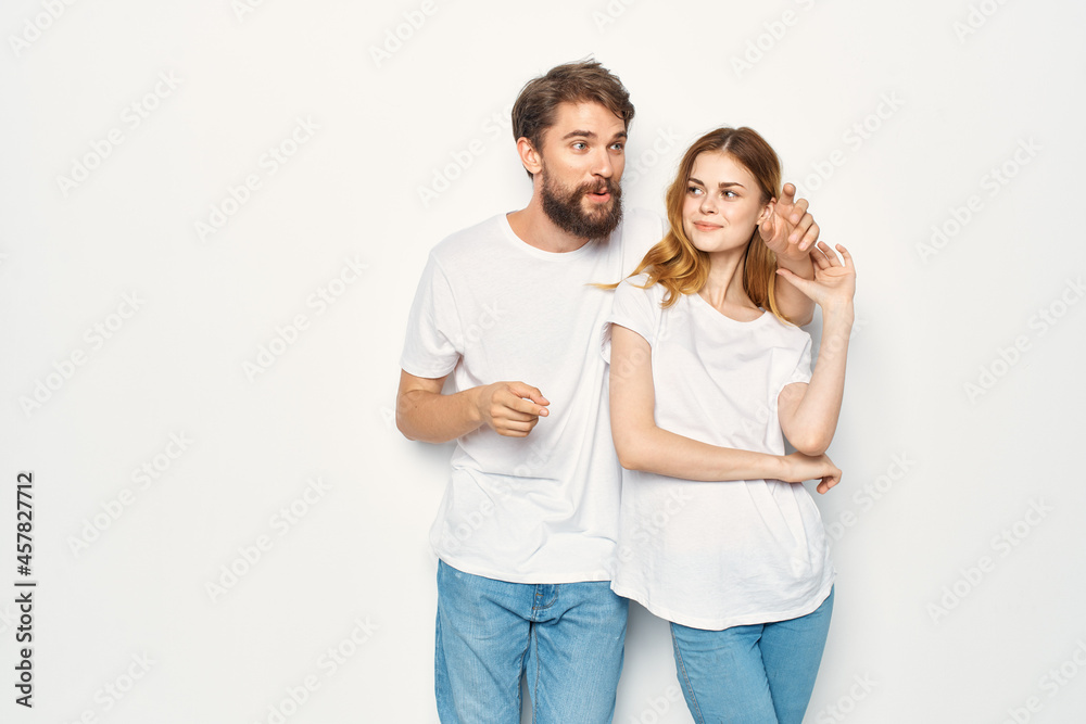 cheerful young couple in white t-shirts casual clothes fashion communication cheerful young couple in white t-shirts casual clothes fashion communication