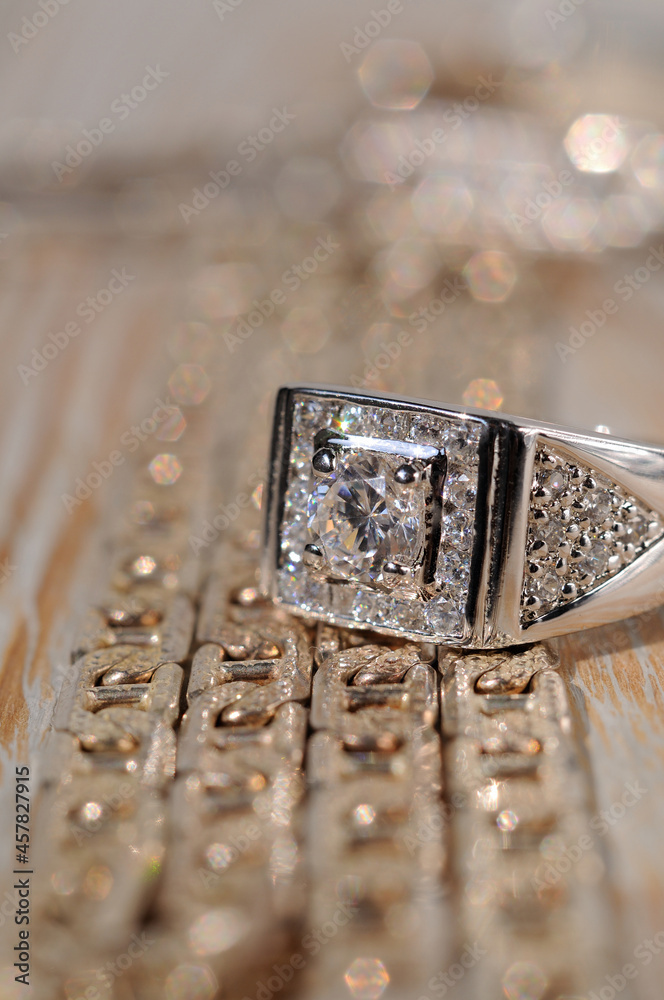 Silver jewelry on a light background closeup. Shallow depth of field