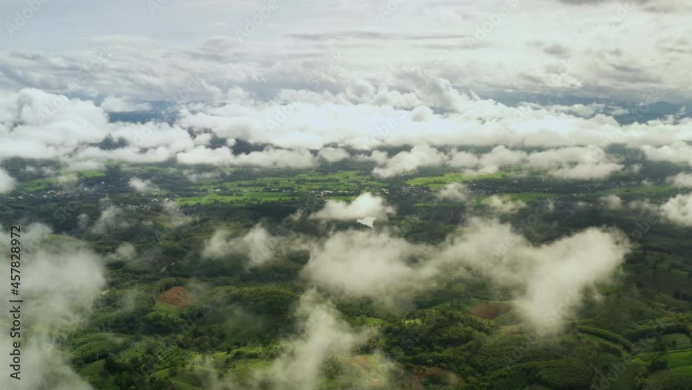 Aerial view. a view of farm from the air Deforestation and forest encroachment on a cloud-covered peak in Nan Province, Northern Thailand Aerial view. a view of farm from the air Deforestation and forest encroachment on a cloud-covered peak in Nan Province, Northern Thailand
