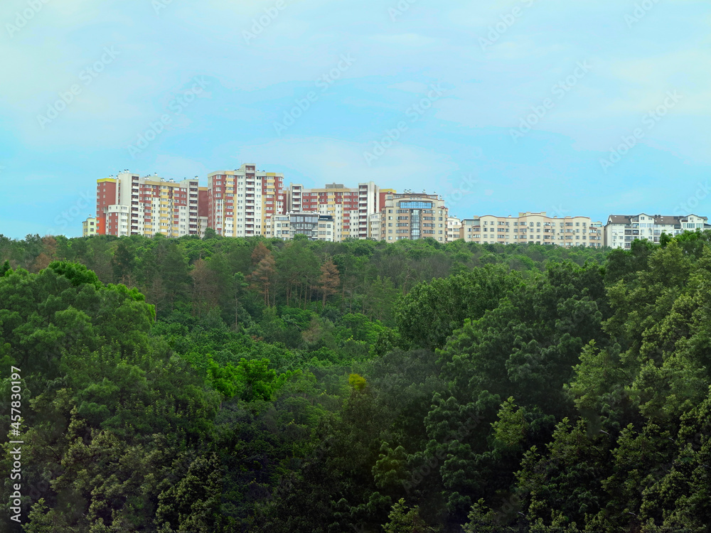 Newly built block of eco flats in middle of green forest