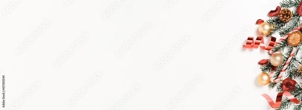 Creative flat lay of christmas traditional composition and new year holiday season. Top view winter christmas decoration on white background. Panoramic banner with copy space for text and Advertising. Creative flat lay of christmas traditional composition and new year holiday season. Top view winter christmas decoration on white background. Panoramic banner with copy space for text and Advertising.
