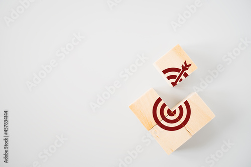 uncompleted dartboard icon on wood block , brainstorming for target or goal concept