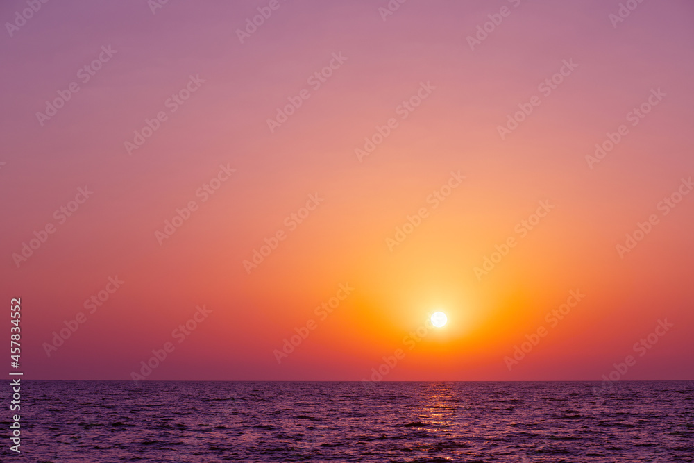 majestic sunset sea,beautiful sun sets over the horizon into the ocean