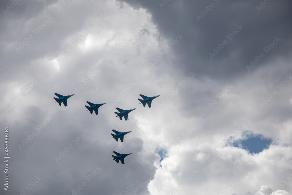 Combat aircraft are flying against the background of the sky. Cloudy sky. Beautiful fighters. Combat aircraft are flying against the background of the sky. Cloudy sky. Beautiful fighters.