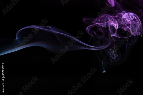 Abstract colored smoke hookah on dark background. Texture. Art Design element. Personal vaporizers fragrant steam. Concept of alternative non-nicotine smoking. E-cigarette. Evaporator.