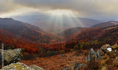 The rays of the sun breaking behind the clouds over Bukowe Berdo, Bieszczady Mountains