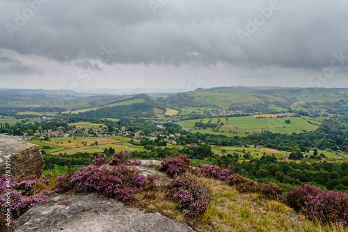 From the top of Curbar Edge out across fields and meadows on misty, grey summer morning in Derbyshire. photo