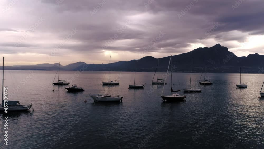 Aerial drone view natural seascape with mountain and water transport under dramatic picturesque sky Aerial drone view natural seascape with mountain and water transport under dramatic picturesque sky