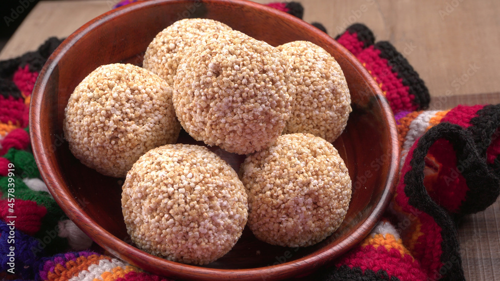 Amarnath seed, Cholai or Rajgira laddo, Also in cube shape called chikki or cake form, Indian sweet and healthy food served in a plate and bowl. Selective focus. Amarnath seed, Cholai or Rajgira laddo, Also in cube shape called chikki or cake form, Indian sweet and healthy food served in a plate and bowl. Selective focus.