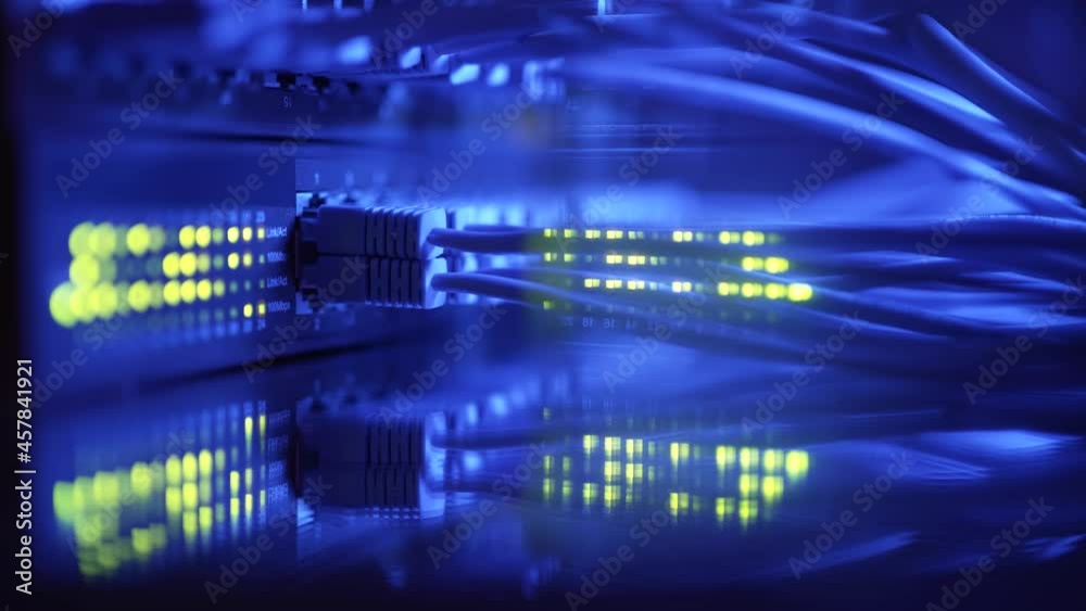 Super computer server racks in datacenter. Concept of big data storage and mining cryptocurrency. Network routers of ISP. Many wires connect to the network interfaces of powerful internet servers Super computer server racks in datacenter. Concept of big data storage and mining cryptocurrency. Network routers of ISP. Many wires connect to the network interfaces of powerful internet servers