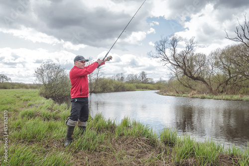 Fisherman on the banks of a picturesque river.