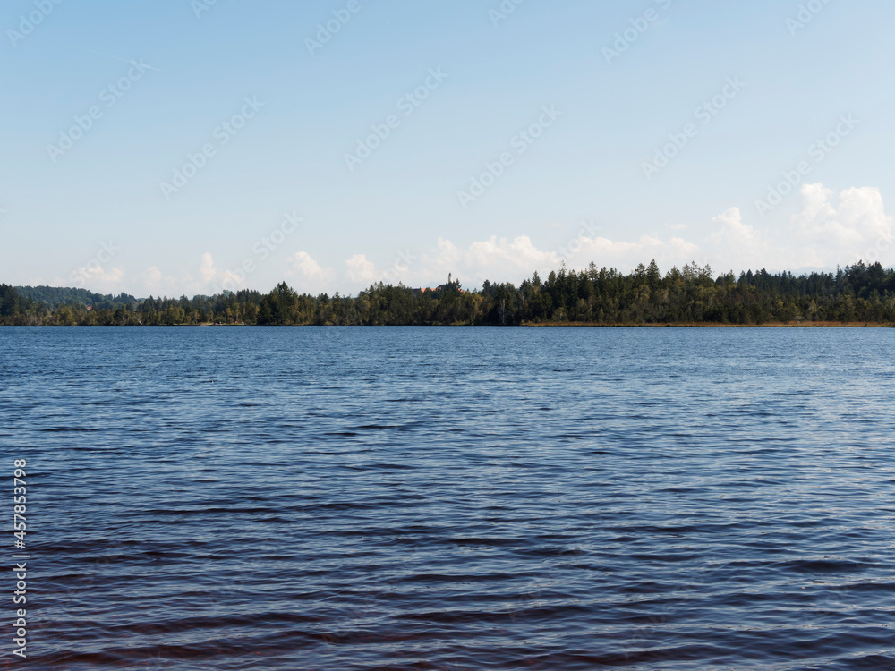 Kirchsee by Sachsenkam in Upper Bavaria. Moor lake and popular bathing water, amber colored. Nature reserve Ellbach-Kirchseemoor Kirchsee by Sachsenkam in Upper Bavaria. Moor lake and popular bathing water, amber colored. Nature reserve Ellbach-Kirchseemoor