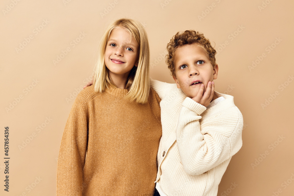 cute stylish kids hugs laughter friendship beige background cute stylish kids hugs laughter friendship beige background