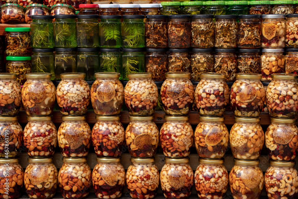 colorful honey with fruit and nuts in the jar colorful honey with fruit and nuts in the jar