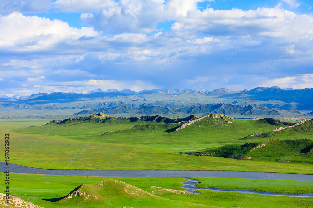 Bayinbuluke grassland natural scenery in Xinjiang,China.The winding river is on the green grassland.