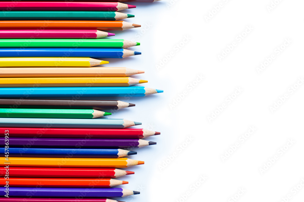 Different colored pencils arranged in a row Different colored pencils arranged in a row
