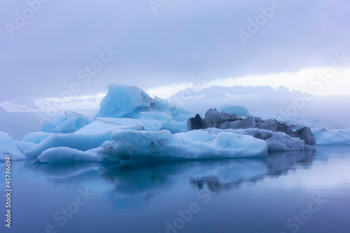 out of this world blue icebergs floating in Glacier Lagoon in Iceland along route 1.