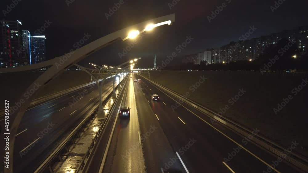 night traffic on the highway in the city skyscraper in the background night traffic on the highway in the city skyscraper in the background