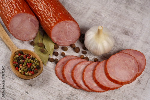 Sausage, cold cuts, and a composition with spices