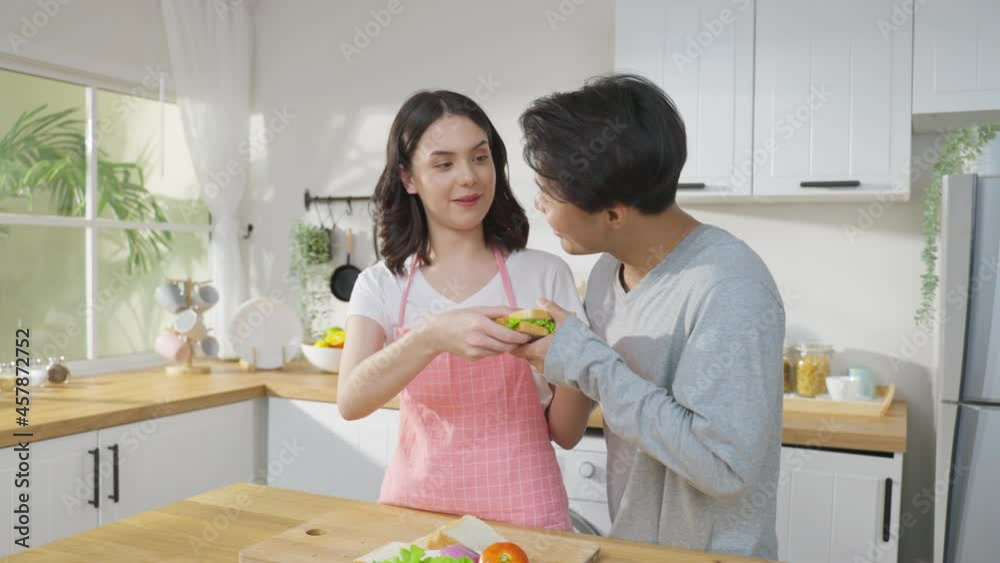 Asian young new marriage couple spend time together in kitchen at home Asian young new marriage couple spend time together in kitchen at home