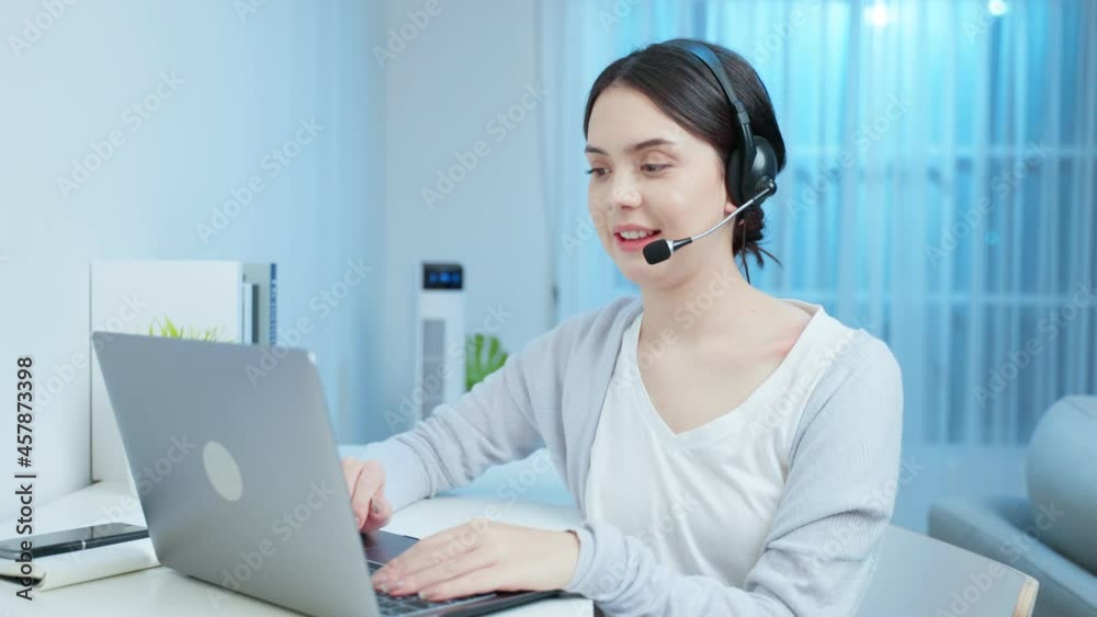 Asian young business woman call center working at home in night time. Asian young business woman call center working at home in night time.